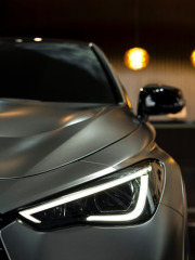 Image of a cars headlight shining showing off the exterior detailing that Andys Auto Wash can do.