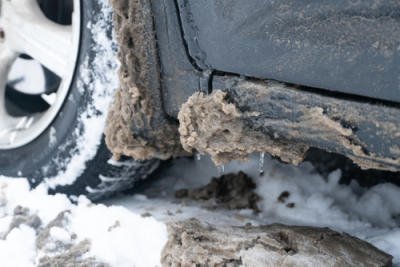 Snow and ice buildup on vehicle during winter. 