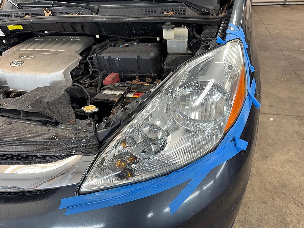 A clear headlight after it had the exterior detailing service of Headlight Restoration at Andy's Autowash.