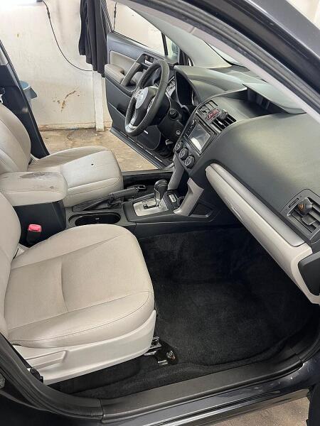 The front passenger's side of the SUV after it has had an interior detailing service by Andy's Autowash