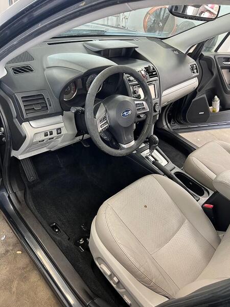 The driver's side of the SUV after it has had an interior detailing service by Andy's Autowash