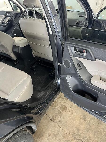 The passenger's side back seat and interior door after it had an interior detailing service by Andy's Autowash