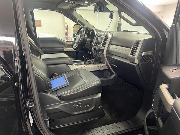 After the Ford F350 has had interior detailing by Andy's Autowash and the seats are shiny and the carpet on the floor is clean.