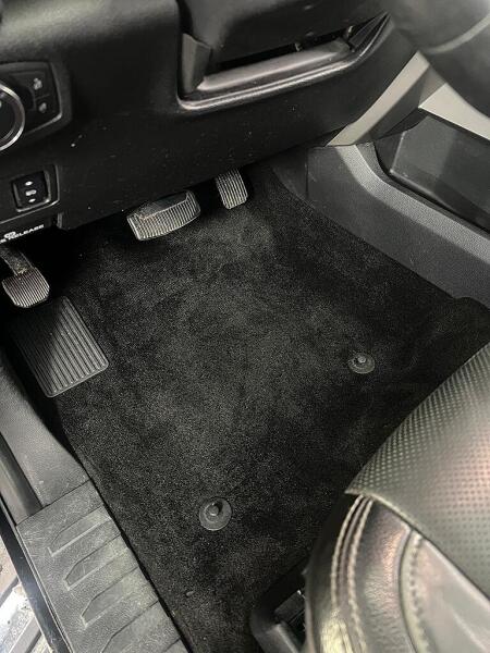 The carpet on the driver's side floor after it had interior detailed by Andy's Autowash.