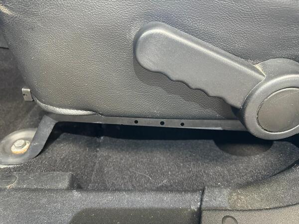 After the detailing service by Andy's Autowash & Detailing, there is no pet hair between the seat and door frame.