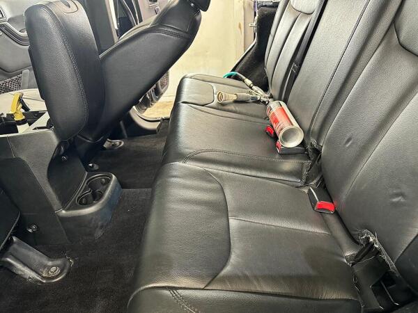 The backseat and floor after an interior detailed service by Andy's Autowash & Detailing. Showing there is now no pet hair.