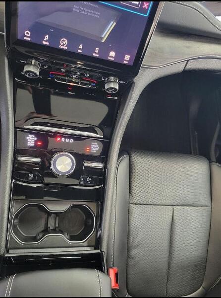 The center console after it had a interior detailing service by Andy's Autowash & Detailing. Showing how everything is clean.